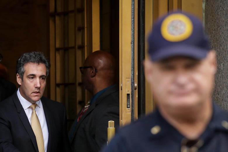 Michael Cohen exits a building.